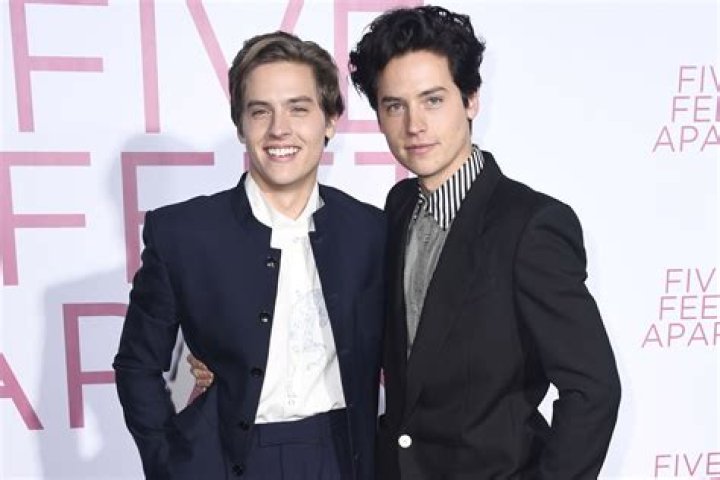 Are the actors related? Jon Bass and Cole Sprouse have a striking resemblance.